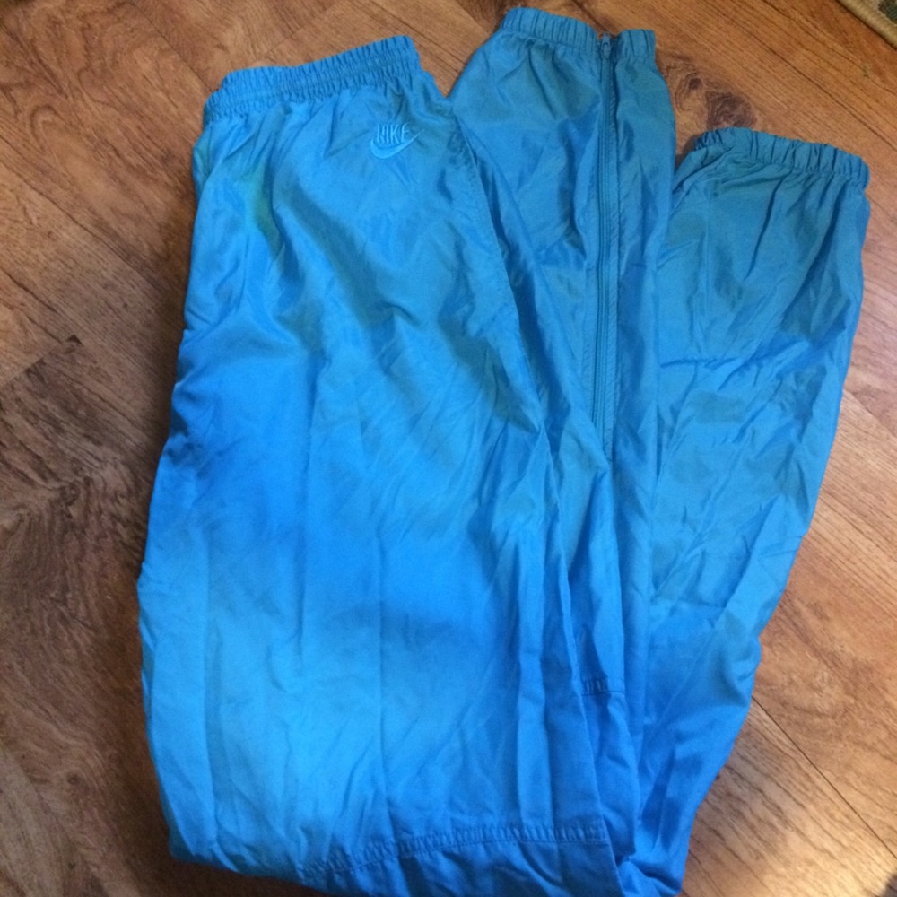 Bright blue Nike windbreaker pants